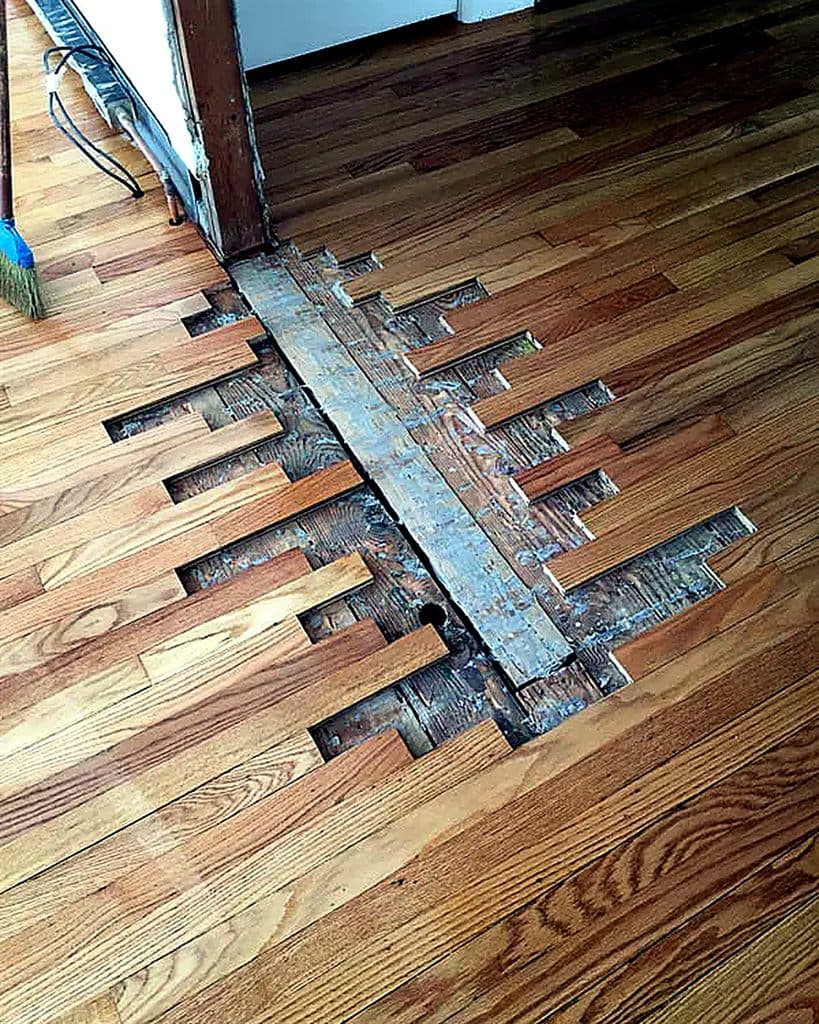 Water-damaged floor section under repair